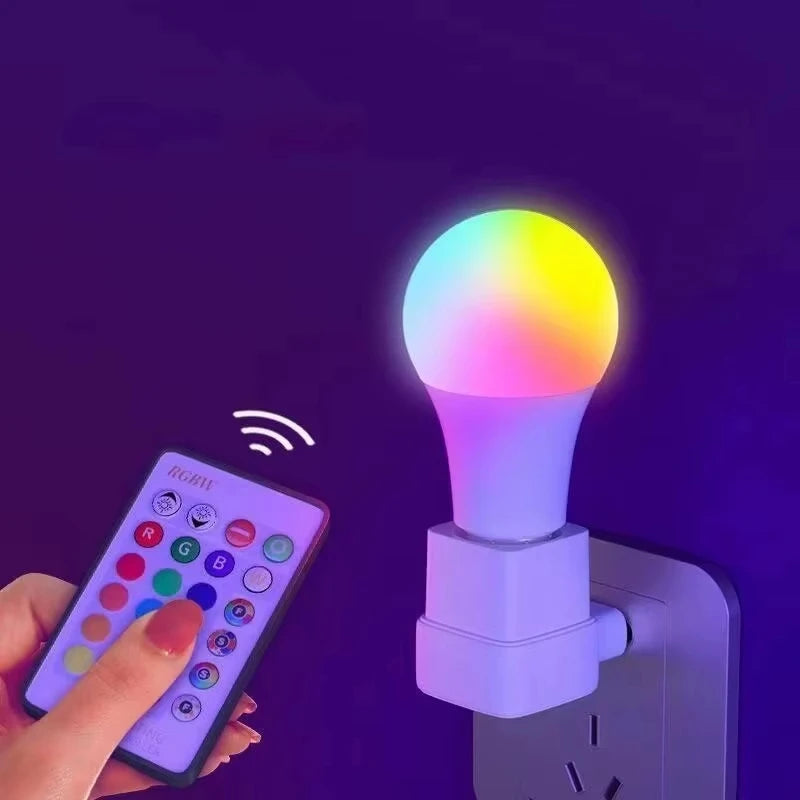 Colorful smart light bulb with remote control on a dark background