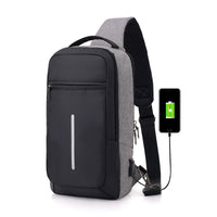 "Man wearing a sleek dark gray anti-theft USB charging chest bag — travel-friendly, lightweight, and stylish everyday carry bag available at Lynda Kay’s Shop."