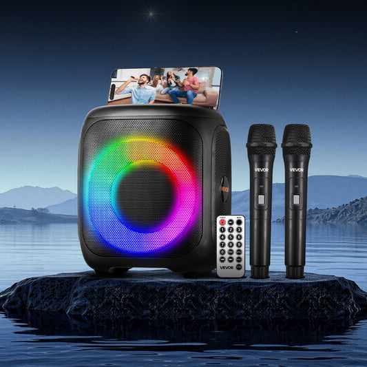 Portable speaker with RGB lighting, two microphones, and remote control on a rock by water with scenic background.