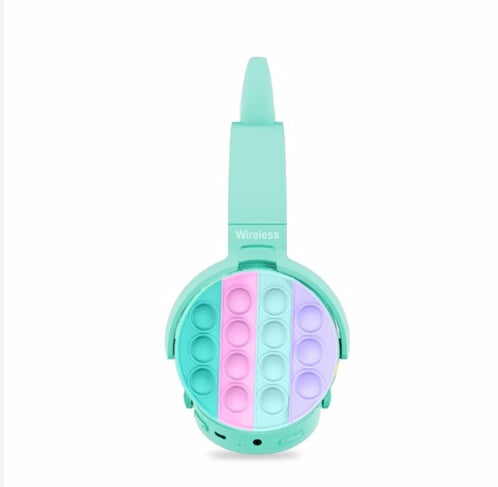 Turquoise wireless cat-ear headphones with pop-it fidgets ear pads for kids.