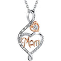 A silver and rose gold heart-shaped pendant necklace with a clear round gemstone and the word 'Mom' written in rose gold script. The silver chain and bail are engraved with 'Love you to the moon and back' and decorated with small clear crystals, shown on a white background.