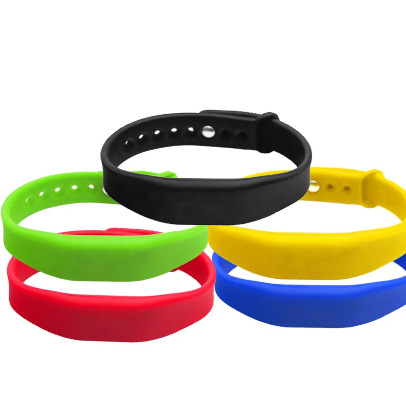 Set of colorful silicone wristbands on a white background