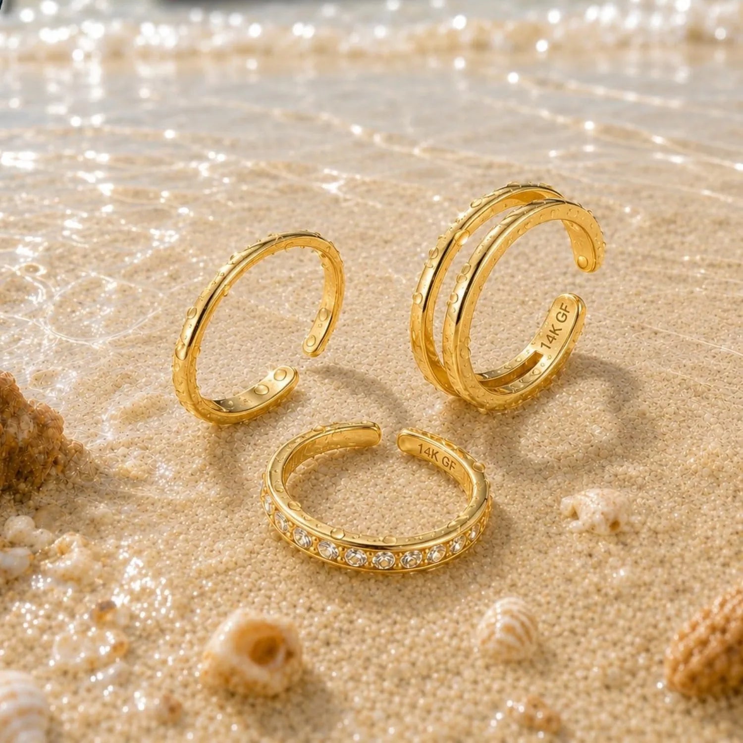 Beach/sand photo:
Triple-band style:
Information graphic:
14K gold-plated adjustable toe rings shown in multiple open-band styles with product detail information.