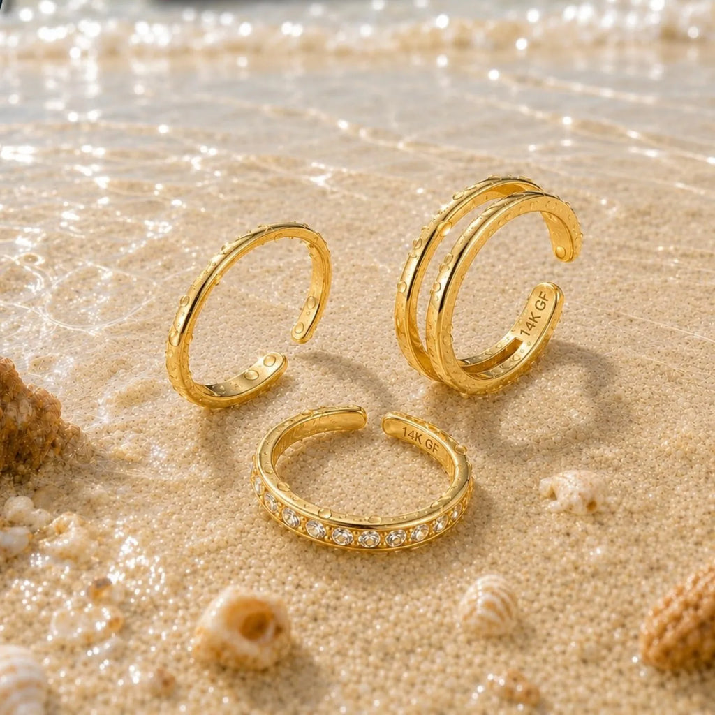 Beach/sand photo:
Triple-band style:
Information graphic:
14K gold-plated adjustable toe rings shown in multiple open-band styles with product detail information.
