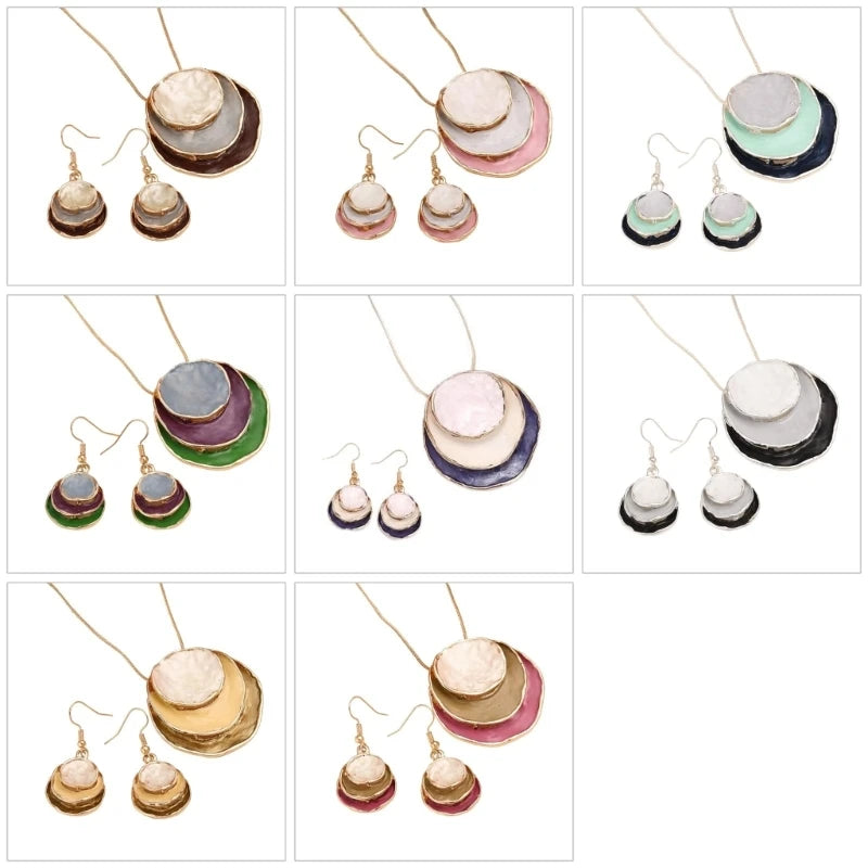 A 3x3 grid showing nine different colorways of handmade layered disc jewelry, including necklaces and matching drop earrings. Each set features hammered circular discs in various colors like gold, pink, green, blue, white, and black, suspended from gold-toned wires.