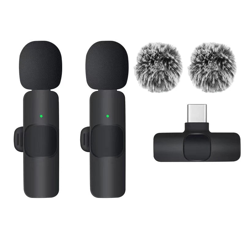 Two microphones with windshields and a receiver on a white background