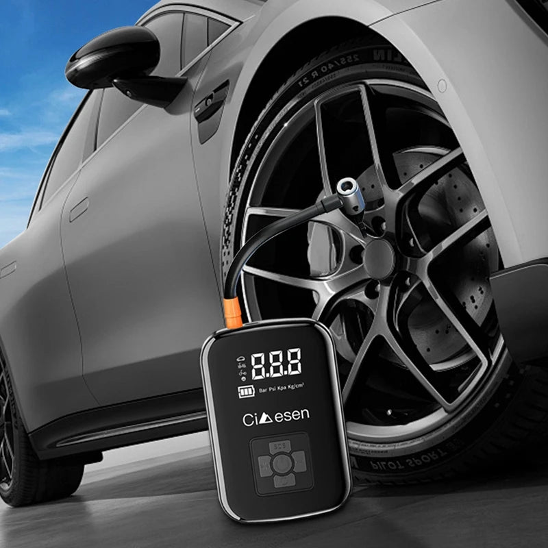 Car tire pressure monitor device with a car in the background