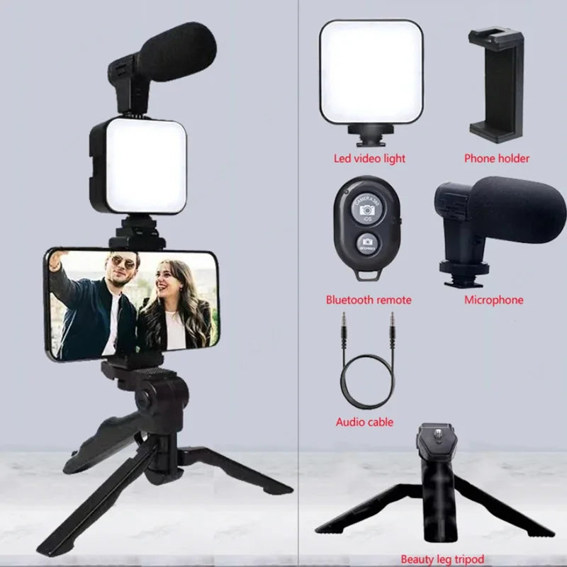 Set of video recording equipment including a phone holder, LED video light, microphone, Bluetooth remote, audio cable, and beauty leg tripod on a gray background.