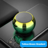 Set of colorful mini orb speakers displayed together
