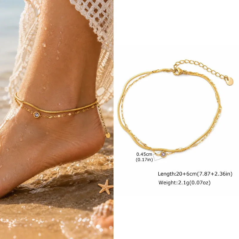 Gold anklet on a foot with beach background and close-up of anklet details.
