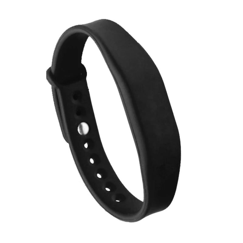 Black fitness tracker band on a white background