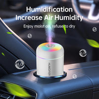 Car humidifier emitting mist with 'Humidification Increase Air Humidity' text on a car dashboard.
