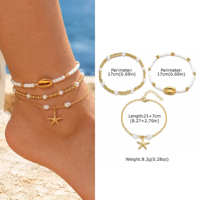 Gold and white beaded anklets on a person's ankle with beach background
