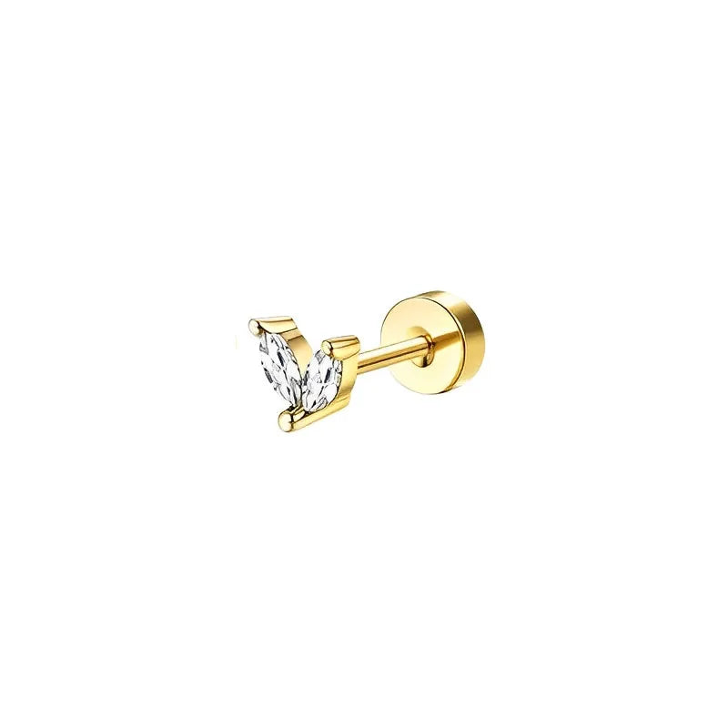 Gold earring with a clear gemstone on a white background