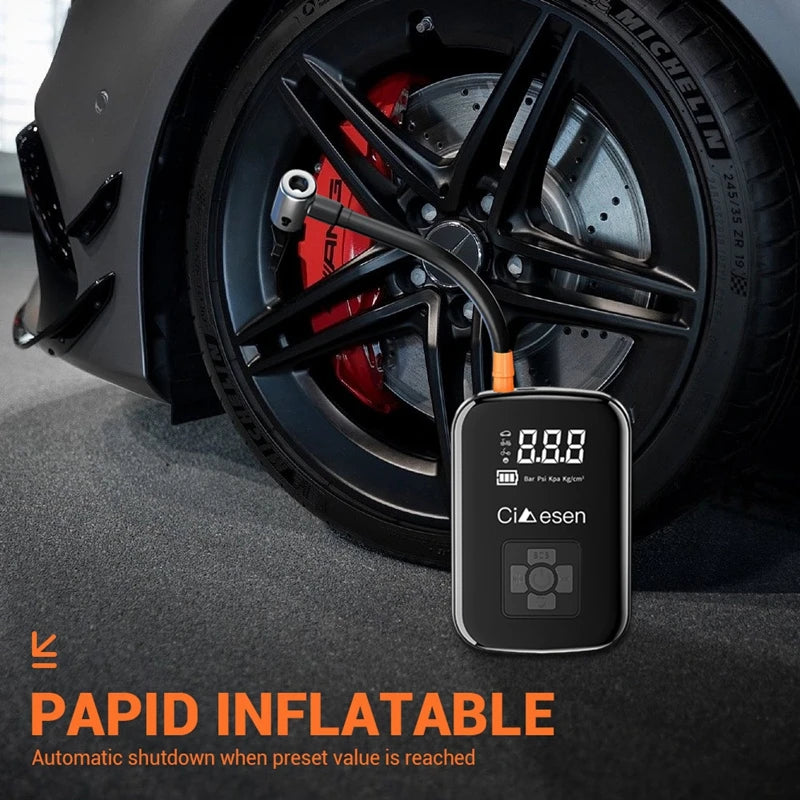 Car tire with a digital inflator displaying pressure next to a car wheel.