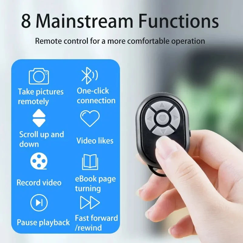 Remote control with functions listed on a blue card held by a hand, against a blurred background.