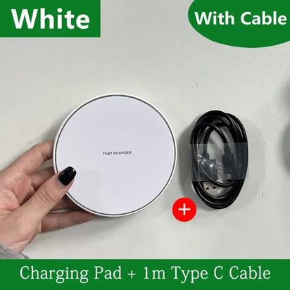 White charging pad with a black cable on a light gray background