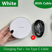 White charging pad with a black cable on a light gray background
