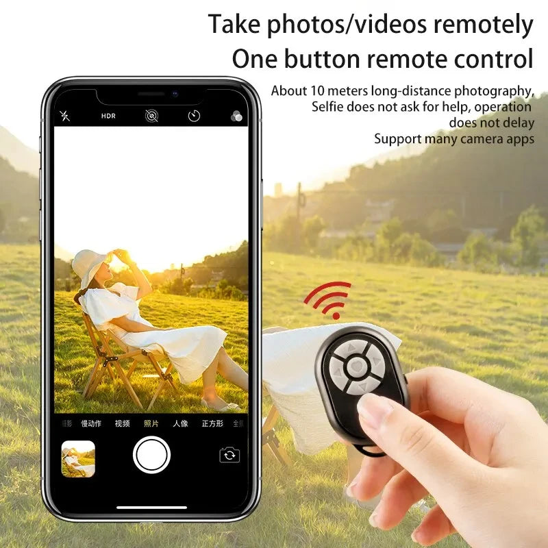 Phone screen showing a person in a field with a remote control device held by a hand.