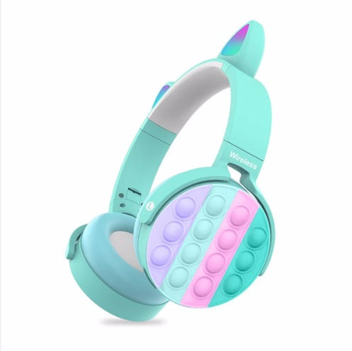 Turquoise wireless cat-ear headphones with pop-it fidgets ear pads for kids.